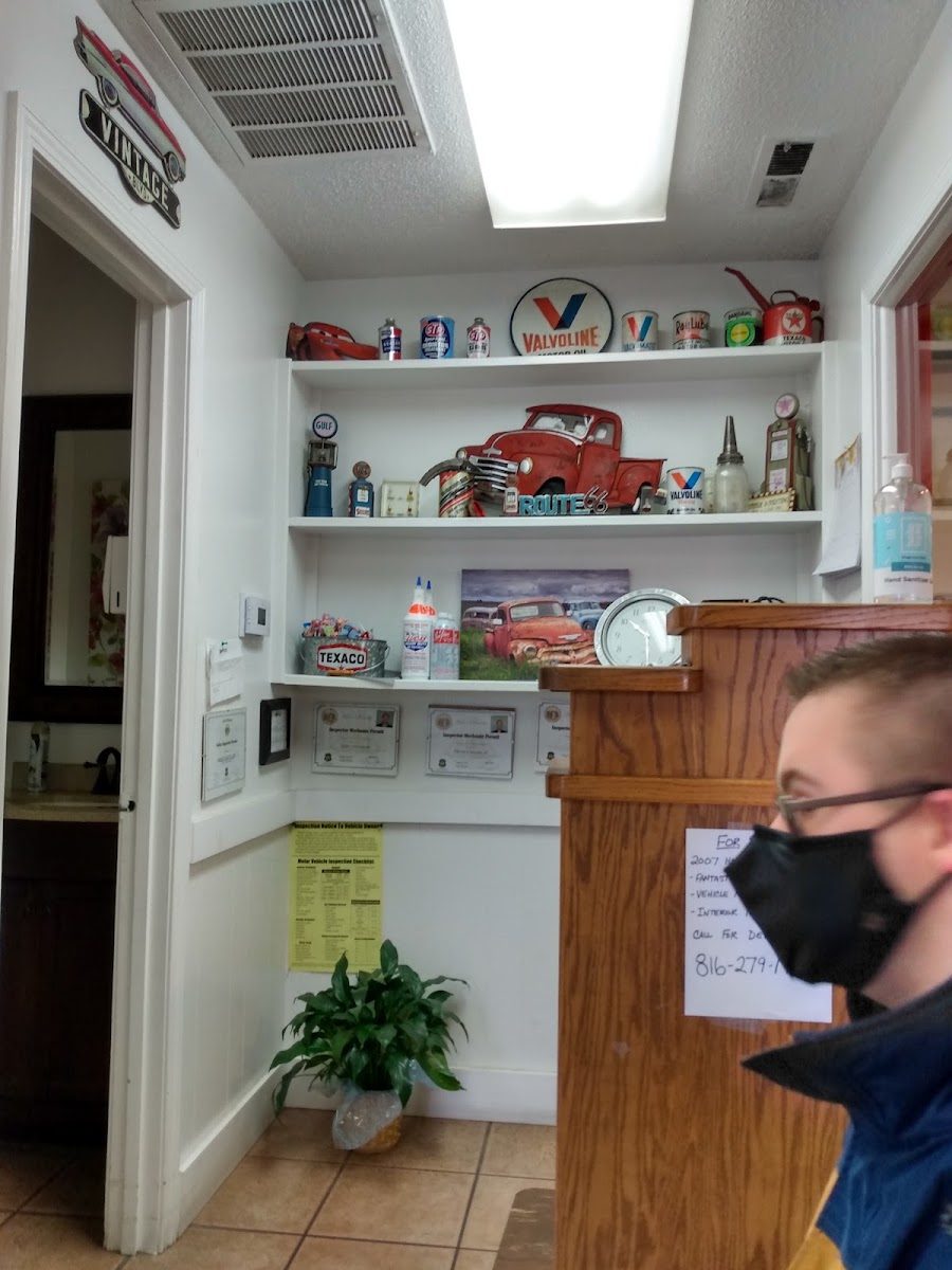 The front counter, with vintage Texaco and Valvoline signs on the shelves